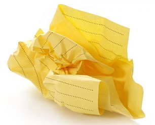 Crumpled ball of yellow legal paper