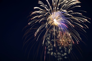 Fireworks light the night sky during the Independence Day Celebration at Whiteman Air Force Base, Mo., June 30, 2016. This was the first year the show used 8-inch shells, versus the usual 6-inch shells, for a bigger display for Whiteman personnel and their families. (U.S. Air Force photo by Senior Airman Danielle Quilla)